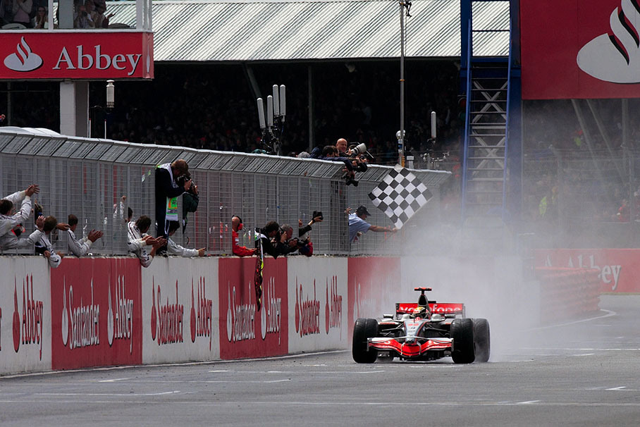 Local hero Lewis Hamilton takes the chequered flag