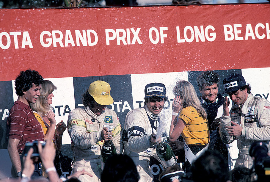 Podium ceremony after the 1980 US GP (West) Long Beach: third placed Emerson Fittipaldi, race winner Nelson Piquet and second placed Riccardo Patrese