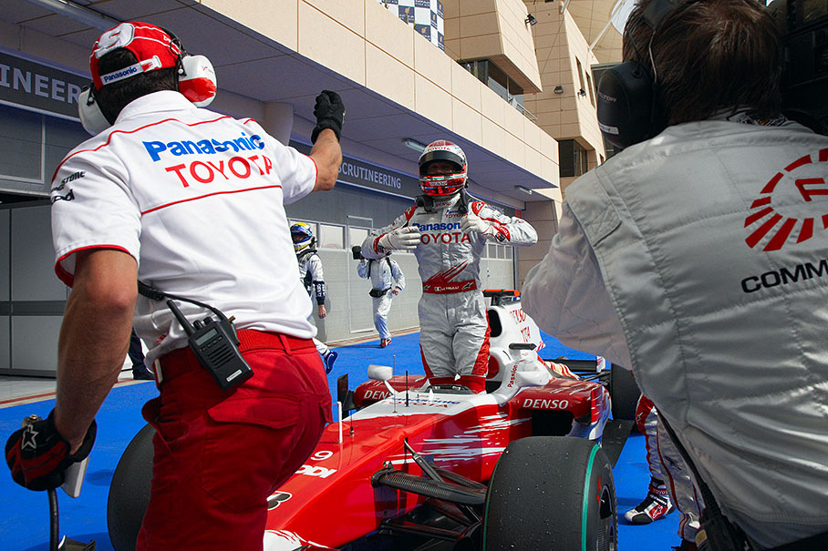 Polesetter Jarno Trulli climbs out of the Toyota car in parc ferme