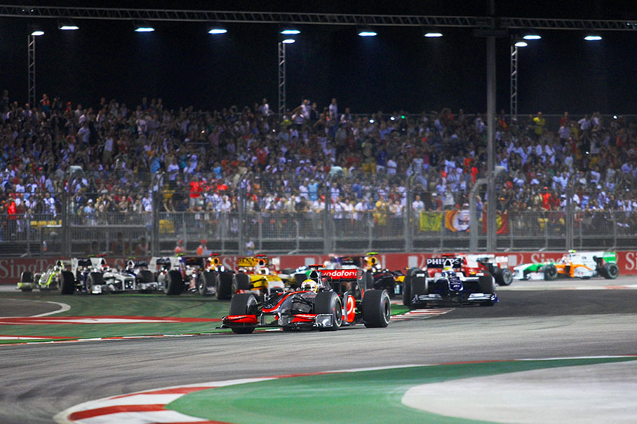 The start field passes the first chicane, Hamilton in the lead in front of Rosberg