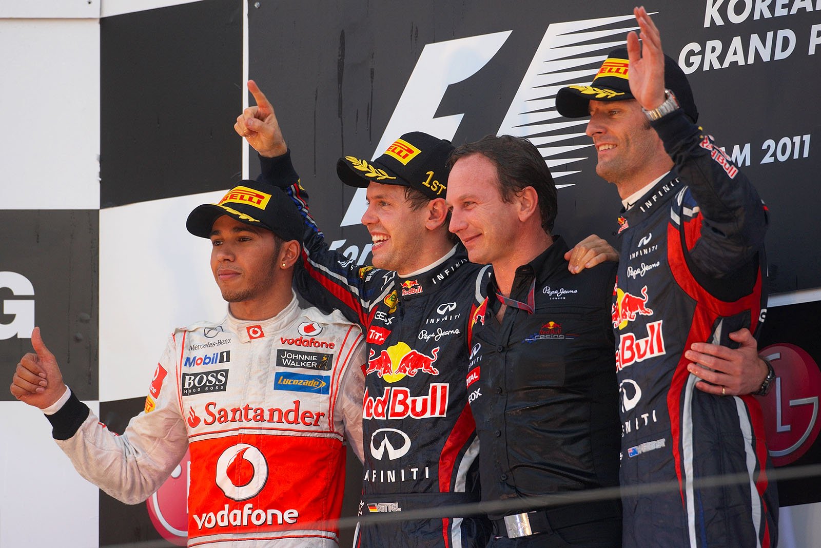 Final podium ceremony group photo of second placed McLaren's Lewis Hamilton, race winner Sebastian Vettel, his third placed team mate Mark Webber and Red Bull Racing team boss Christian Horner as winning constructor in their middle