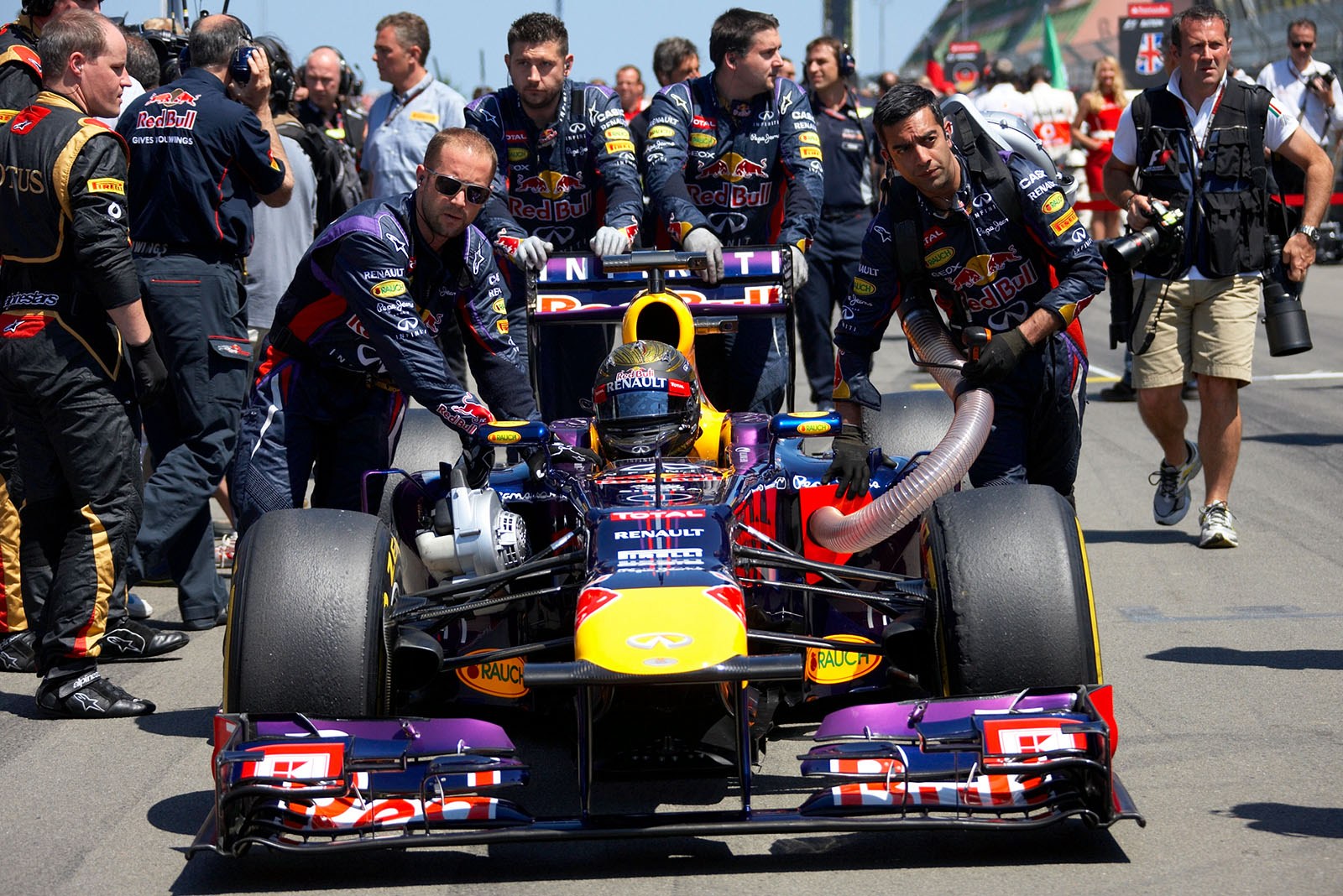 Sebastian Vettel, Red Bull Racing, is pushed to his grid position
