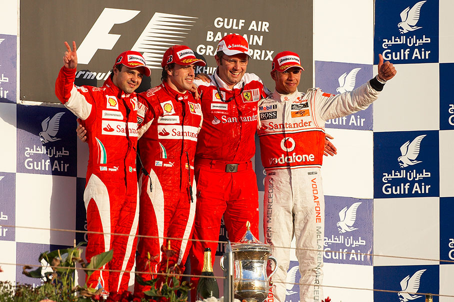 Podium group photo after the season's first race: Second placed Felipe Massa, race winner Fernando Alonso, Ferrari team principal Stefano Domenicali and third placed Lewis Hamilton of McLaren