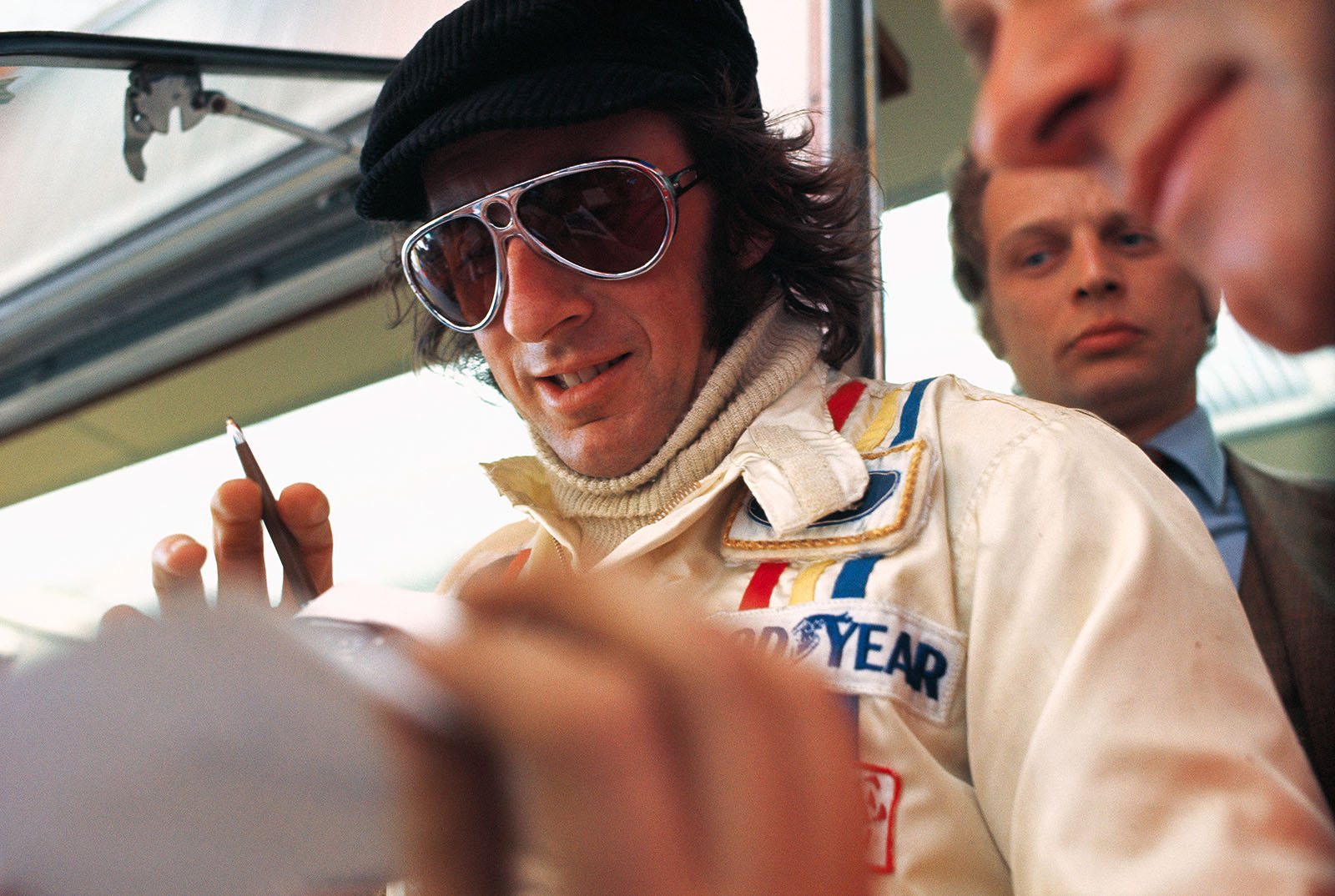 Jackie Stewart signs autographs after his victory at Montjuich Park, Spanish Grand Prix, 1971