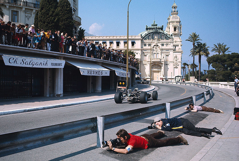 Photographers hide behind the new barriers to get a better shot