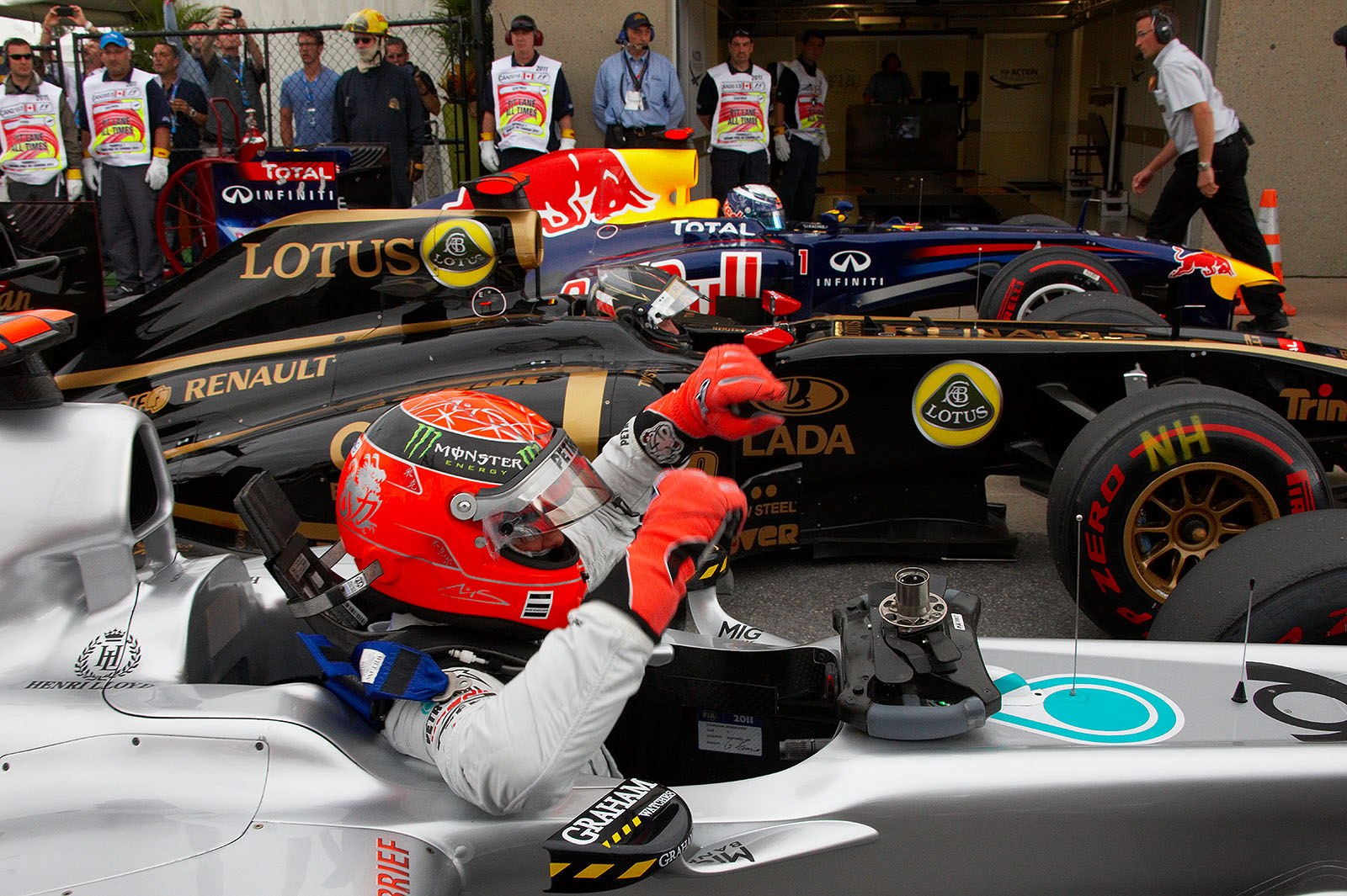 Michael Schumacher, Nick Heidfeld and Sebastian Vettel climb out of their cars in parc ferme after qualifying