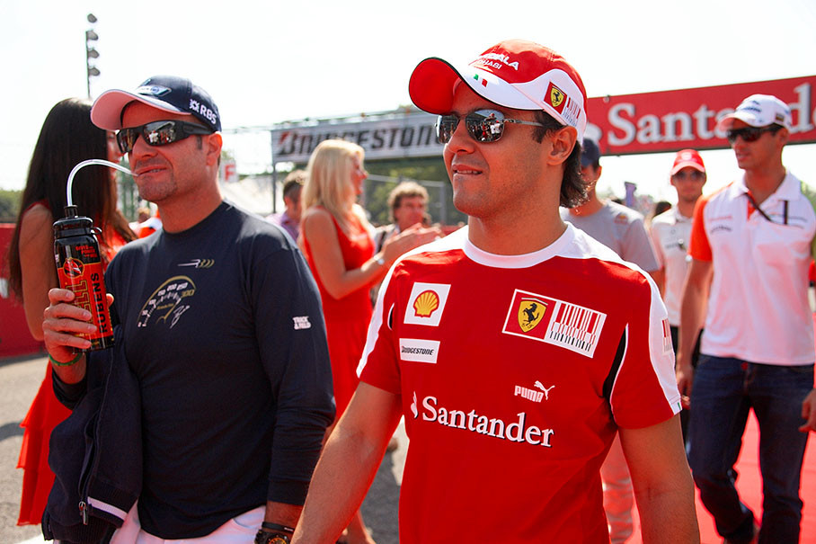 The Brazilians Barrichello and Massa walk to drivers parade