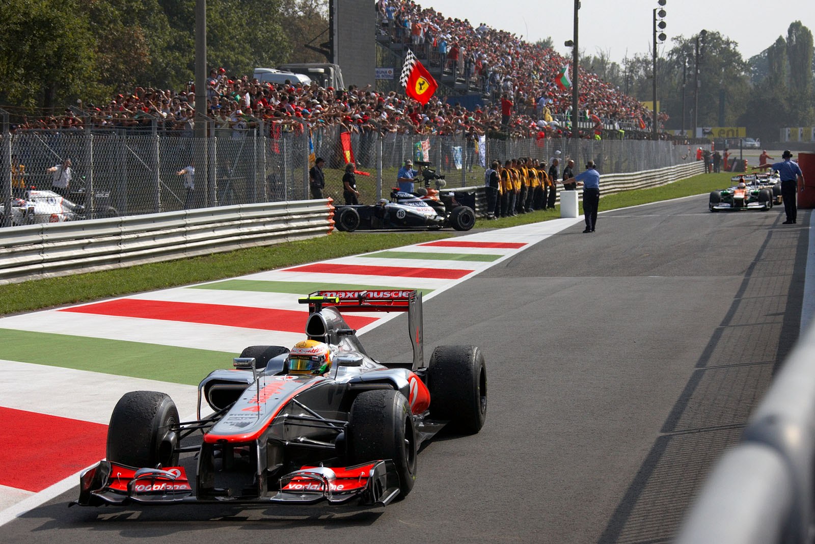 Race winner Lewis Hamilton of McLaren returns from his lap of honour after the race
