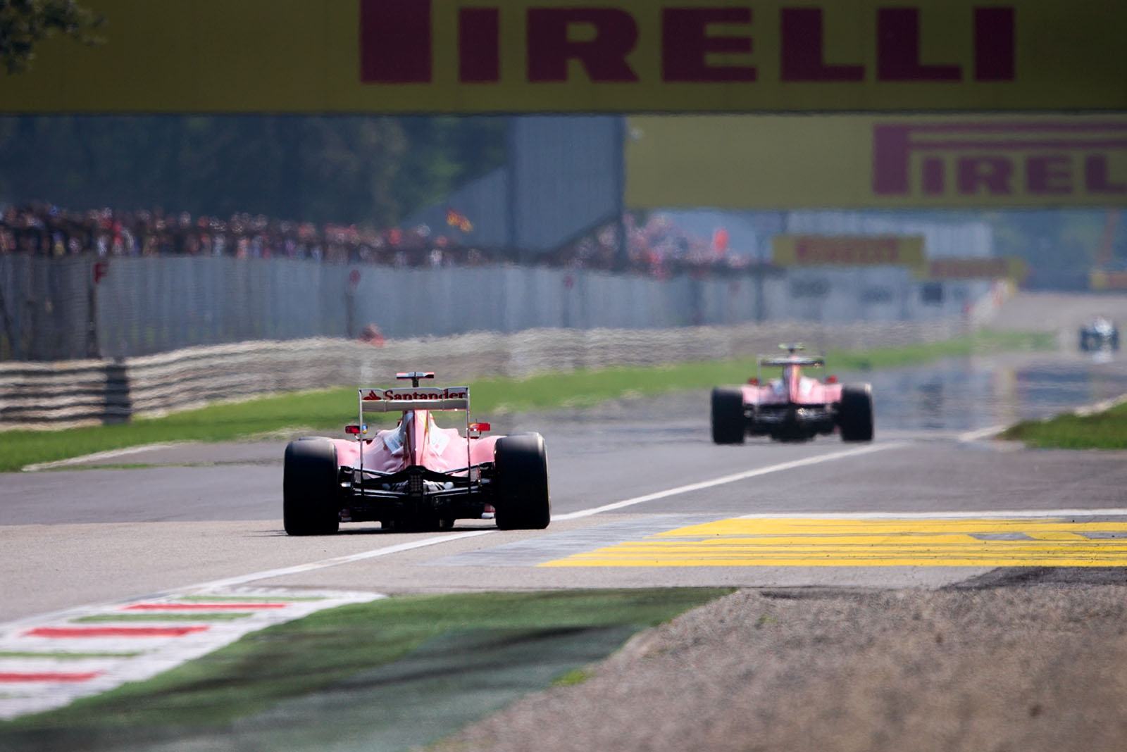 Two Ferrari race cars at the exit of Variante Ascari
