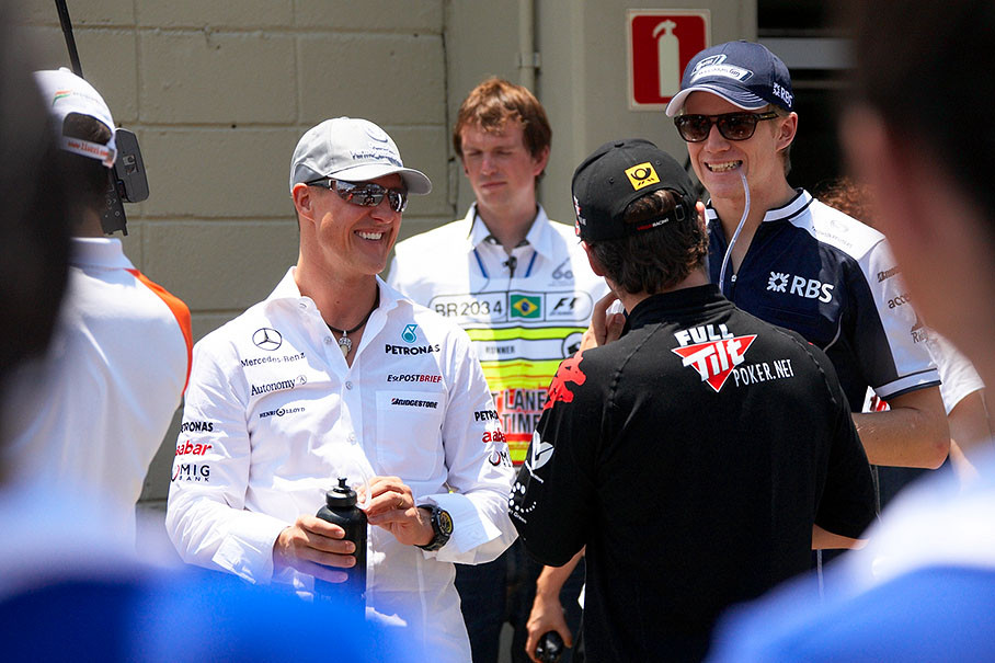 The German drivers group up on Sunday morning for the drivers parade: Michael Schumacher, polesitter Nico Hulkenberg and Timo Glock