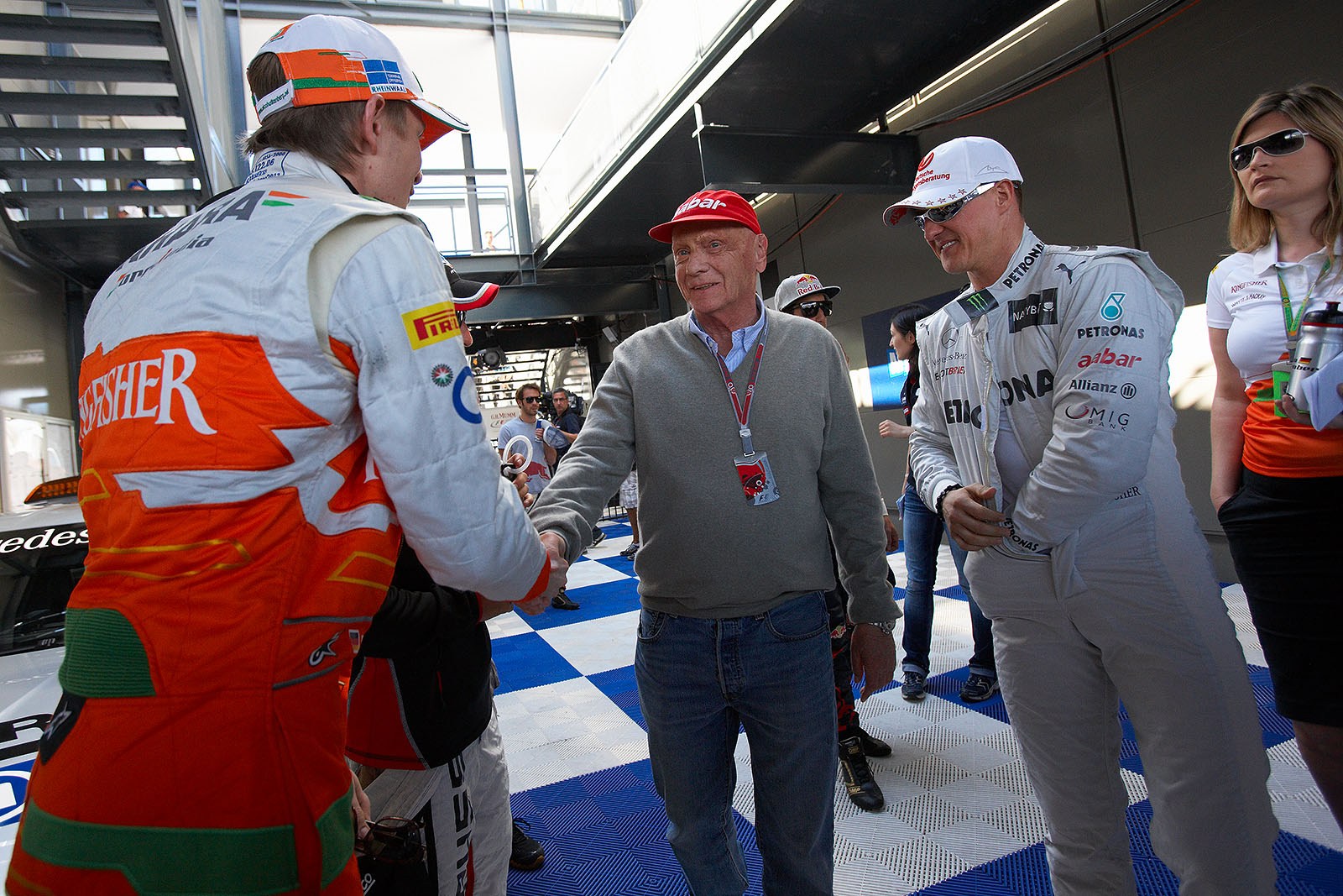 Before the drivers parade, TV presenter Niki Lauda shakes hands with Force Indias Nico Huelkenberg