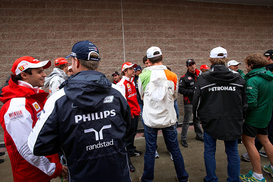 The F1 drivers cluster themselves for the drivers parade