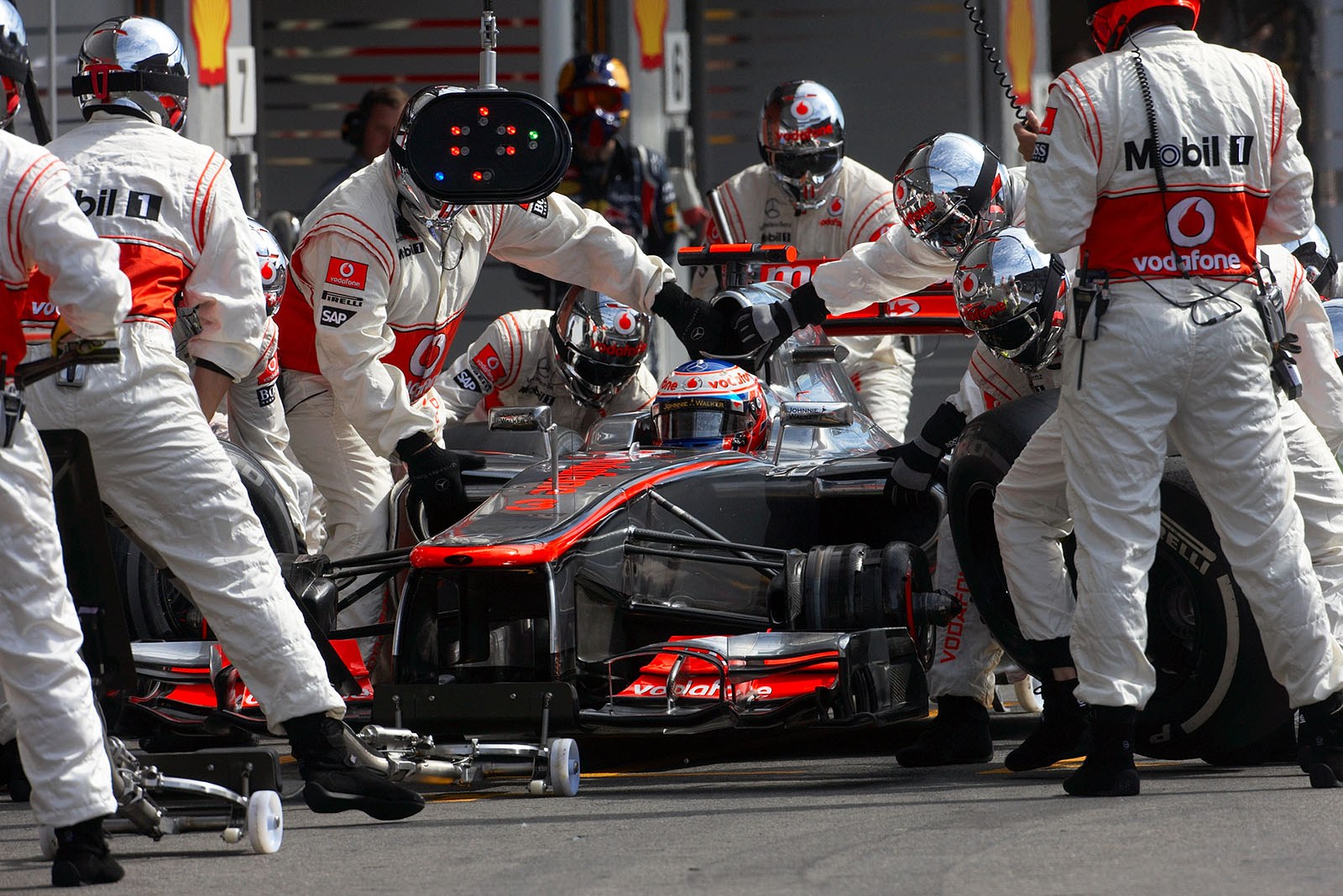 Jenson Button, McLaren Mercedes, makes a very fast pit stop
