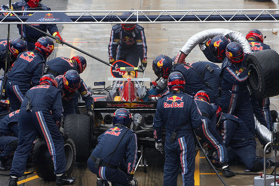 Mark Webber is being serviced at Red Bull pits in lap 28