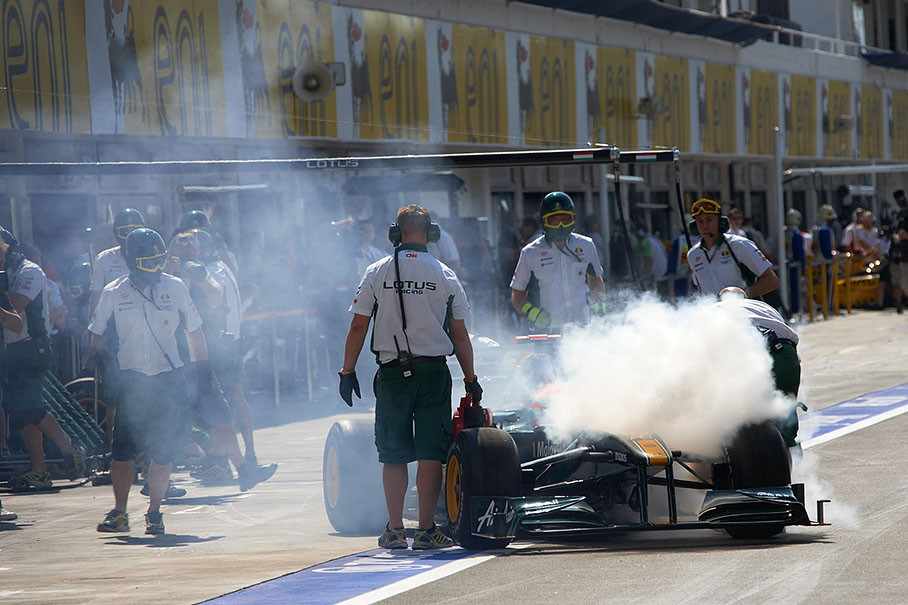 Cold smoke against overheating brakes of Trulli's Lotus-Cosworth