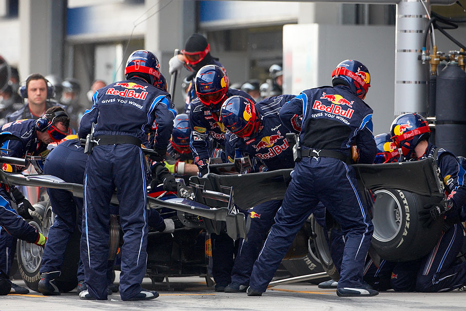 Third placed Mark Webber comes to Red Bull pits, a new front wing is being attached