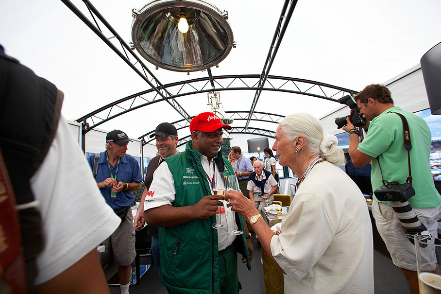 Hazel Chapman and Tony Fernandes, Lotus F1 Team Principal, enjoy a glass of champagne during the inauguration of the new Lotus motorhome
