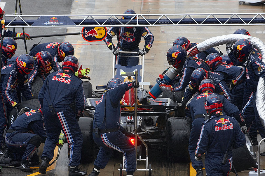 Mark Webber is being serviced at Red Bull pits in lap 28