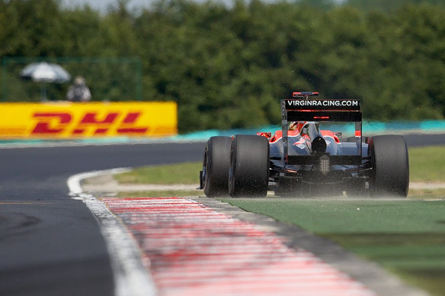 Timo Glock, Virgin Racing, takes the corner wide