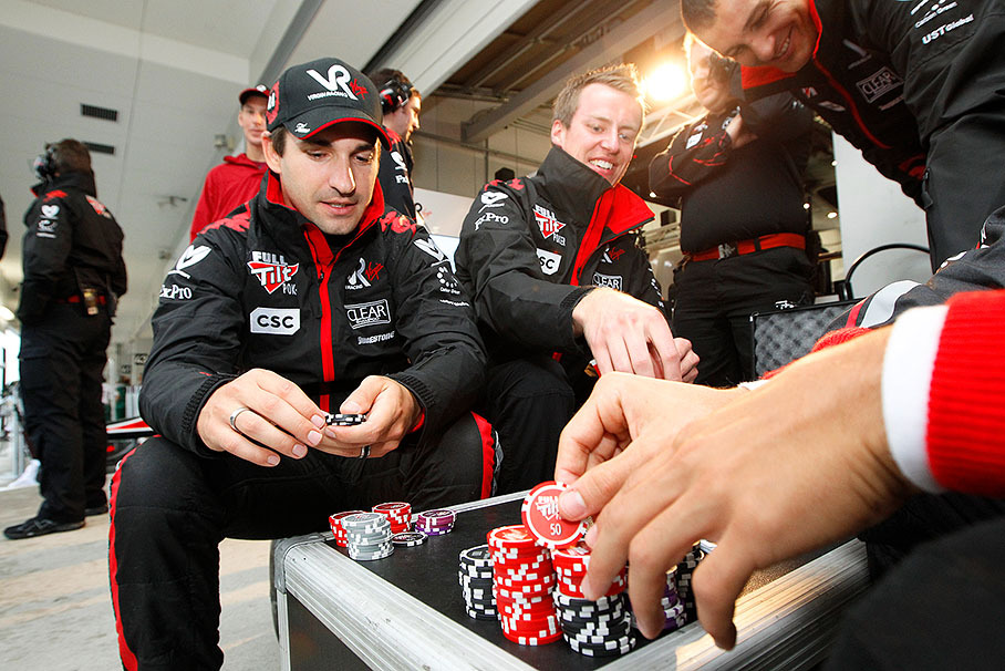 Whilst they wait for the qualifying to commence after its interruption by heavy rain, Timo Glock and Lucas di Grassi play a bit of sponsored poker