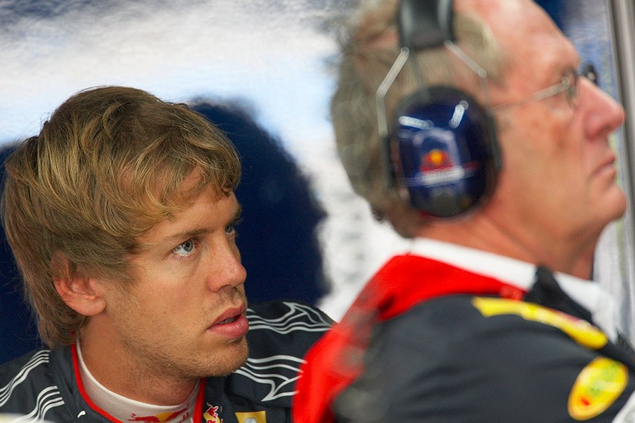 Sebastian Vettel in Red Bull pits with advisor Marko