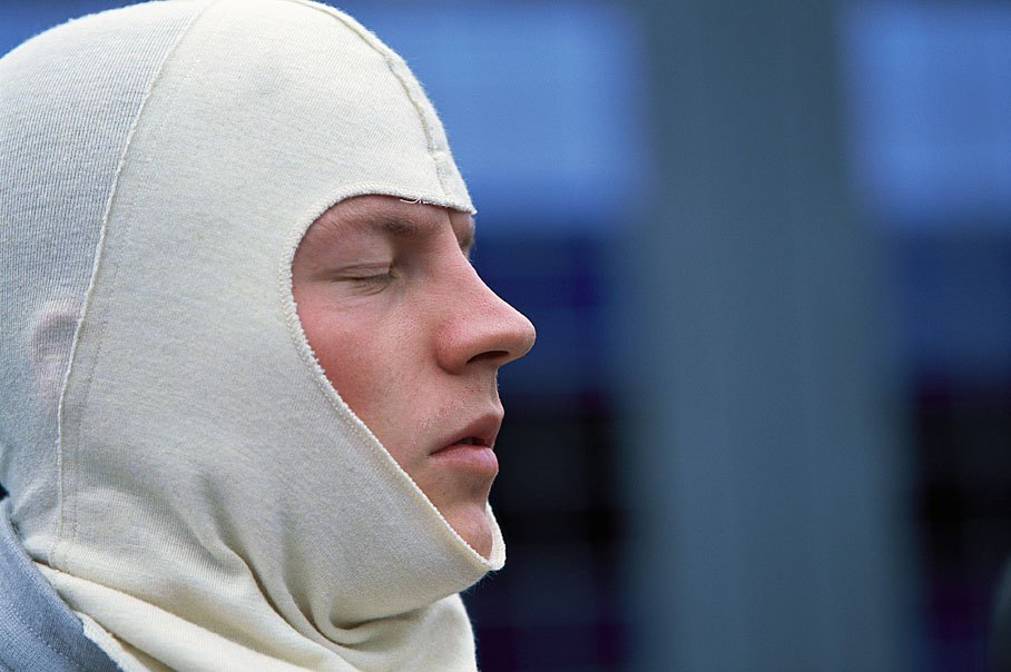 Kimi Raikkonen puts a fluffy balaclava on
