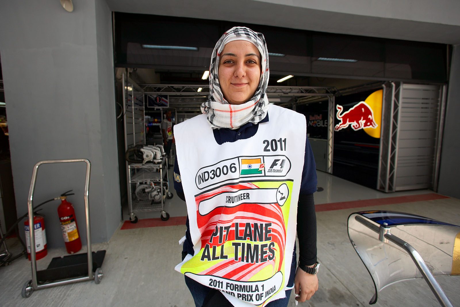 A friendly pit lane marshal guards the Red Bull pits