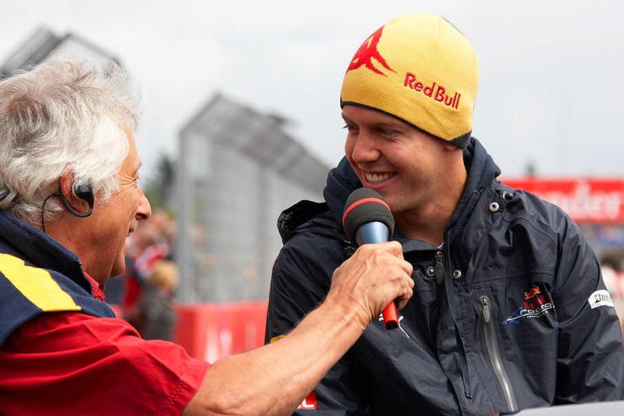 Sebastian Vettel is being interviewed by Bob Constanduros before drivers parade