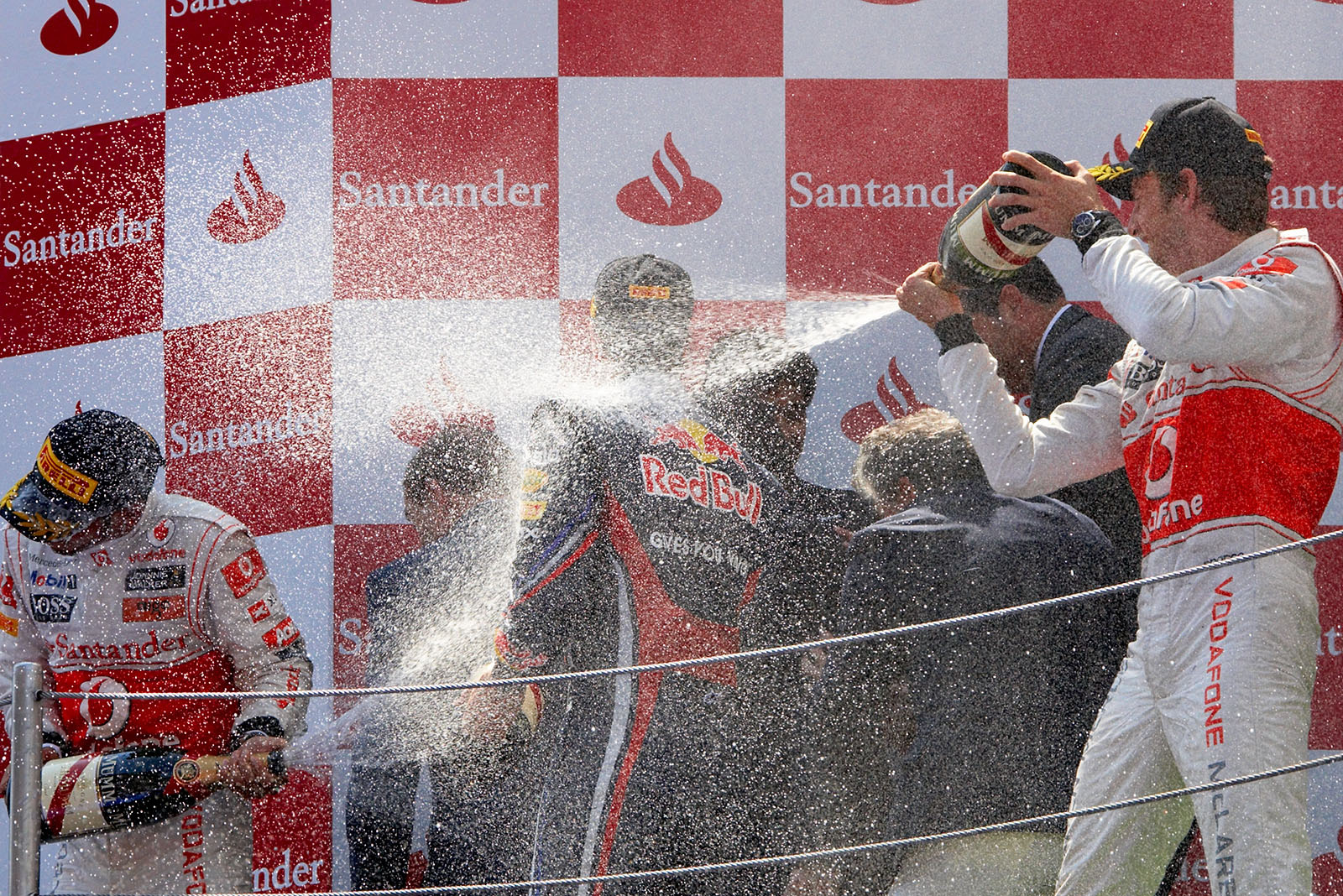 Champagne celebrations on podium with Vettel, Hamilton and Button.