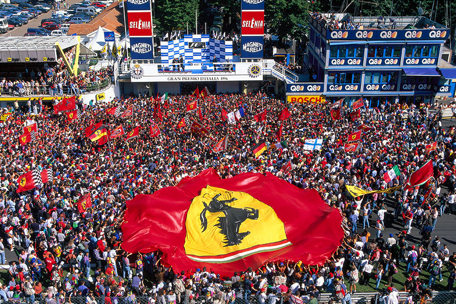 Ferrari tifosi infront of the podium, waiting for winner Michael Schumacher.