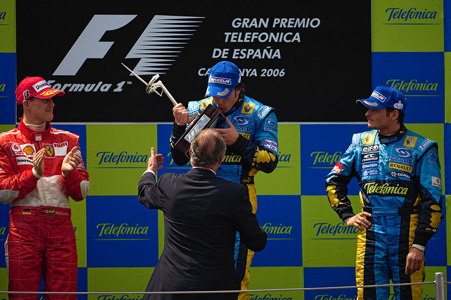 Alonso kissing his trophy, shaped like the main sponsor's famous Telefonica tower which is overlooking Barcelona, handed over by Juan Carlos, King of Spain