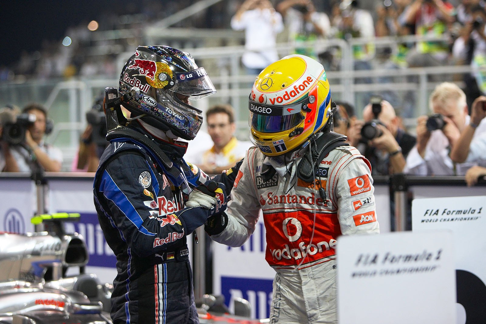 Race winner and new World Champion Sebastian Vettel receives congratulations from championship competitor Hamilton