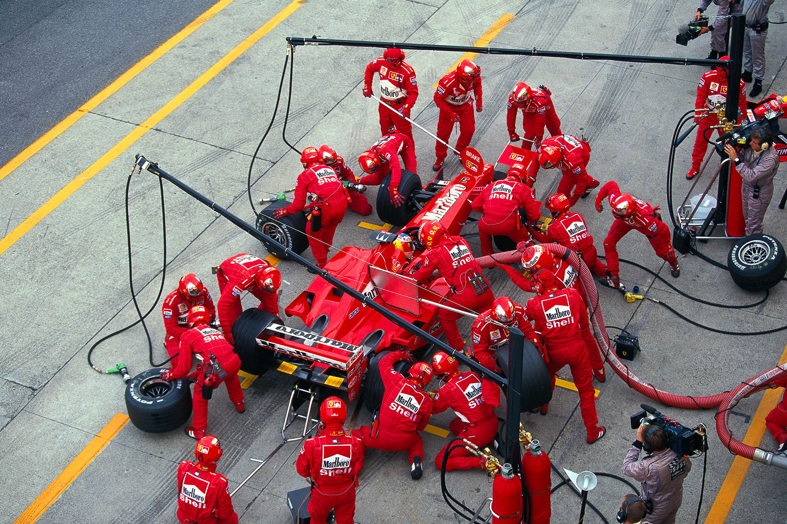 Michael Schumacher, Ferrari, makes his refueling pit stop