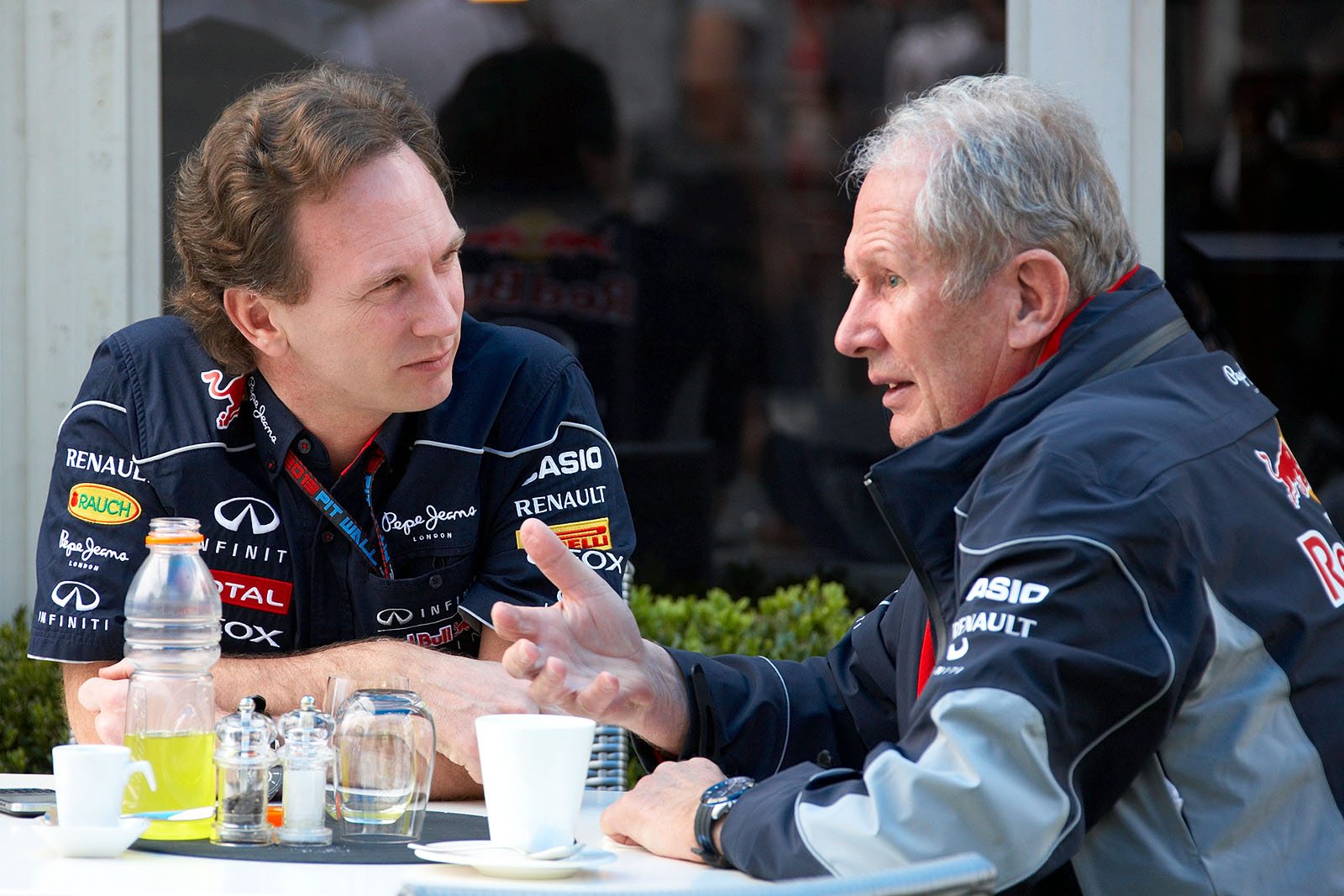 Red Bull team principal Christian Horner listens to Dr. Helmut Marko