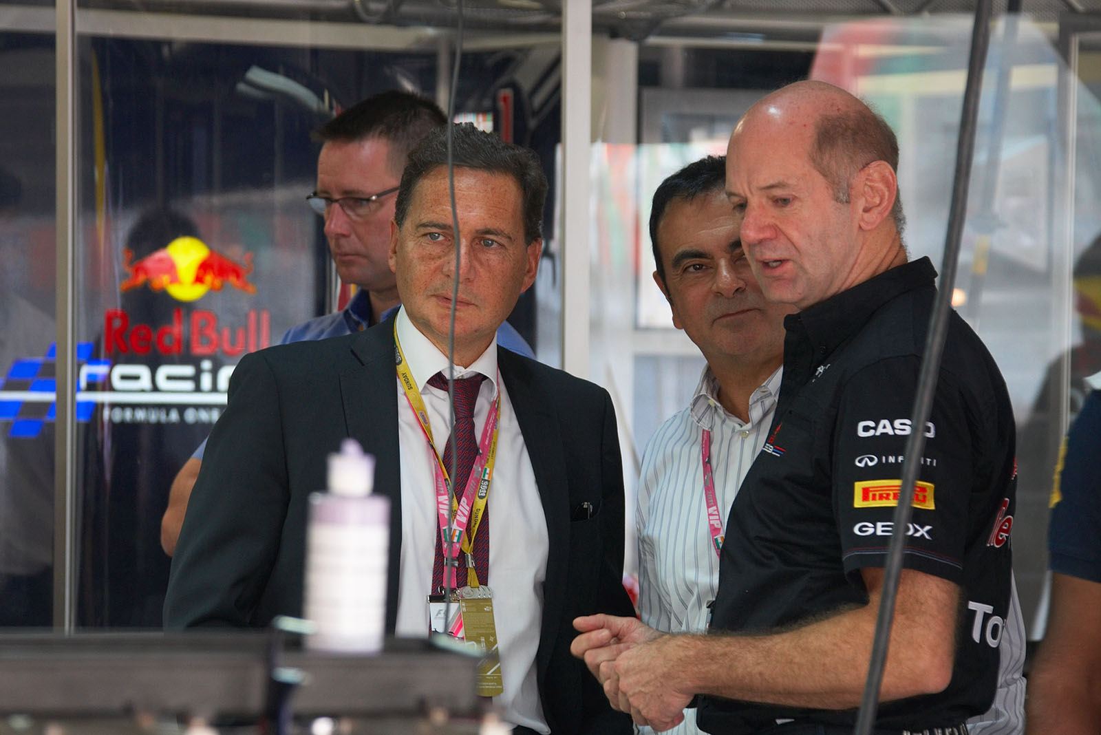 Eric Besson, French Minister of Industry, and Carlos Ghosn, CEO of Renault-Nissan, visit technical director Adrian Newey for an informational chat in Red Bull pits