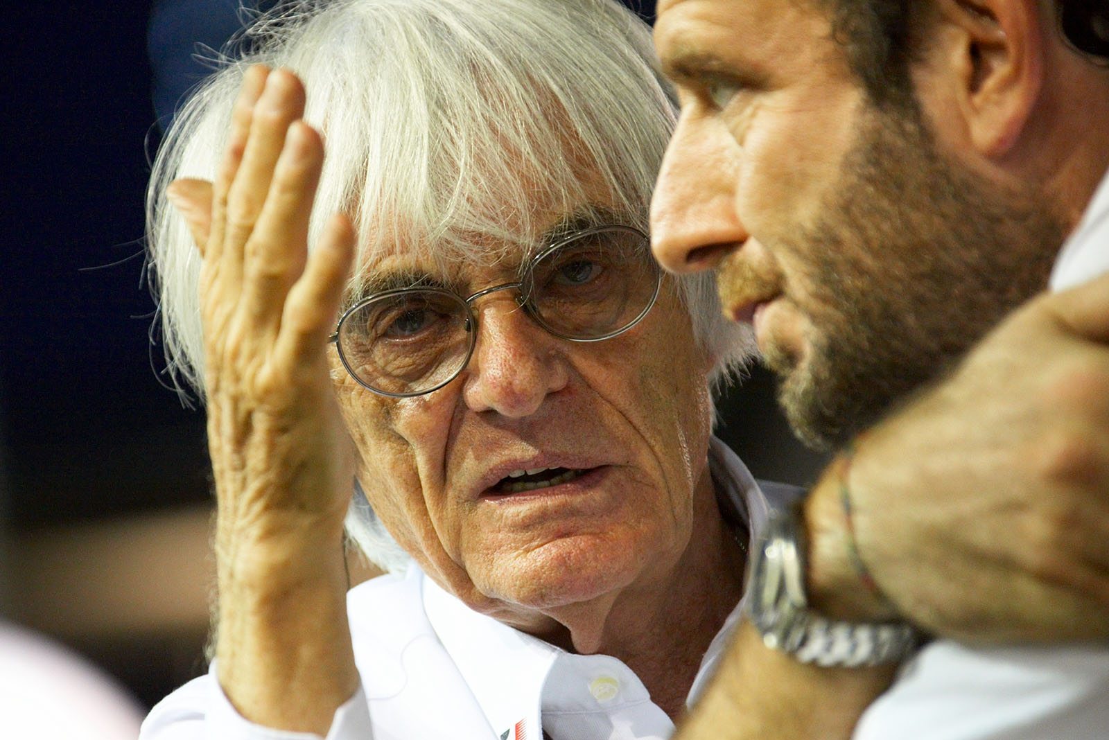 Bernie Ecclestone, CEO of Formula One Management, talkes to FIA’s media delegate Bonciani