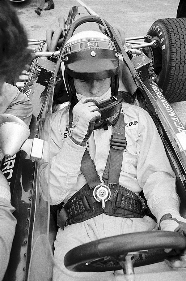 Jackie Stewart is strapped into the cockpit of the BRM P83 H16 during the British GP in Silverstone 1967
