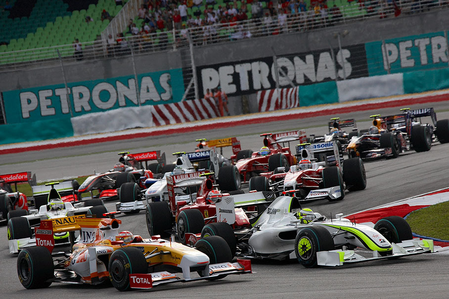 The start field squeezes through first chicane, Jenson Button in front (behind Rosberg and Trulli who passed already)