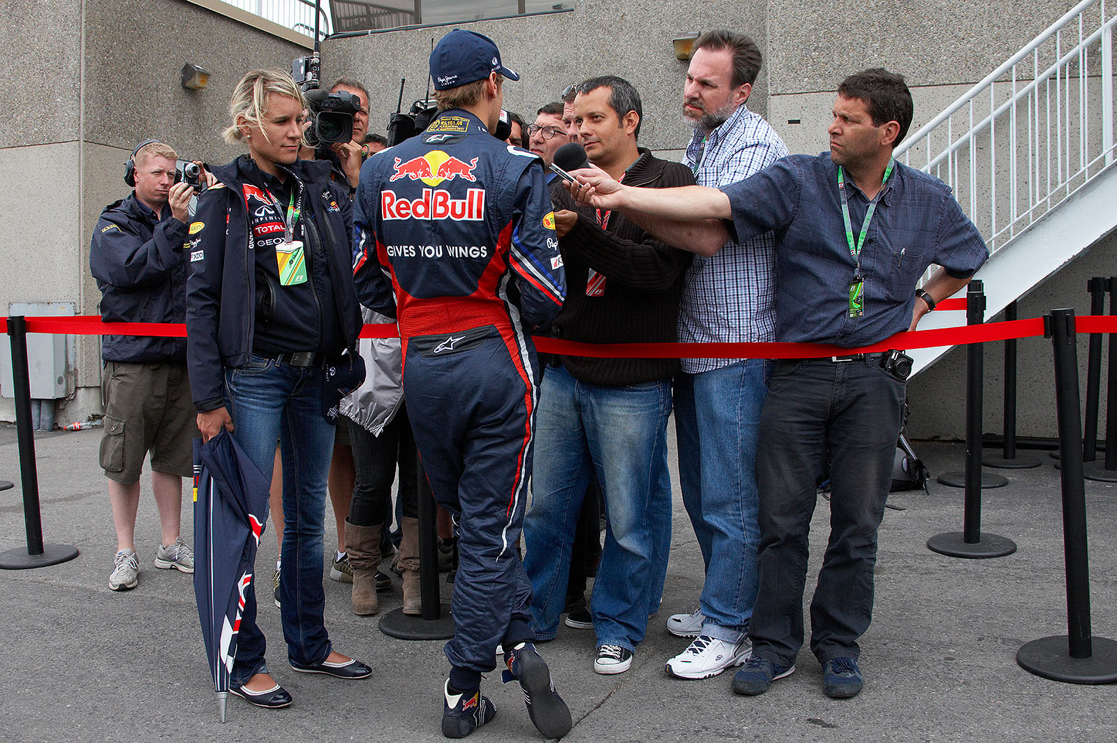 Polesetter Sebatian Vettel gives interviews after qualifying