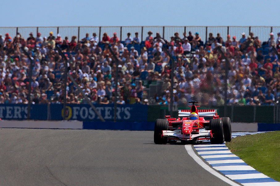 Felipe Massa practicing in front of crowded grandstands