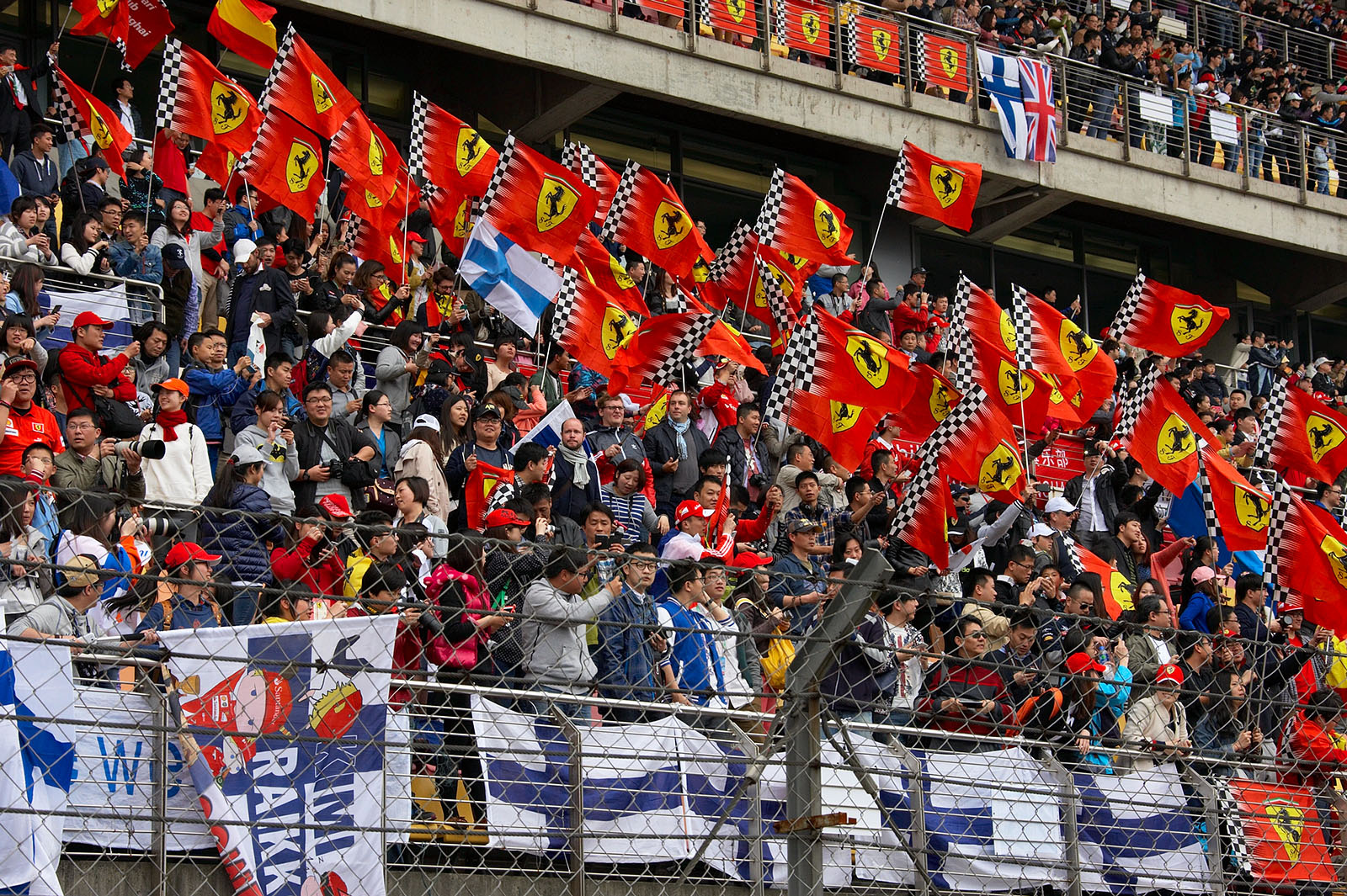 A large group of Ferrari fans