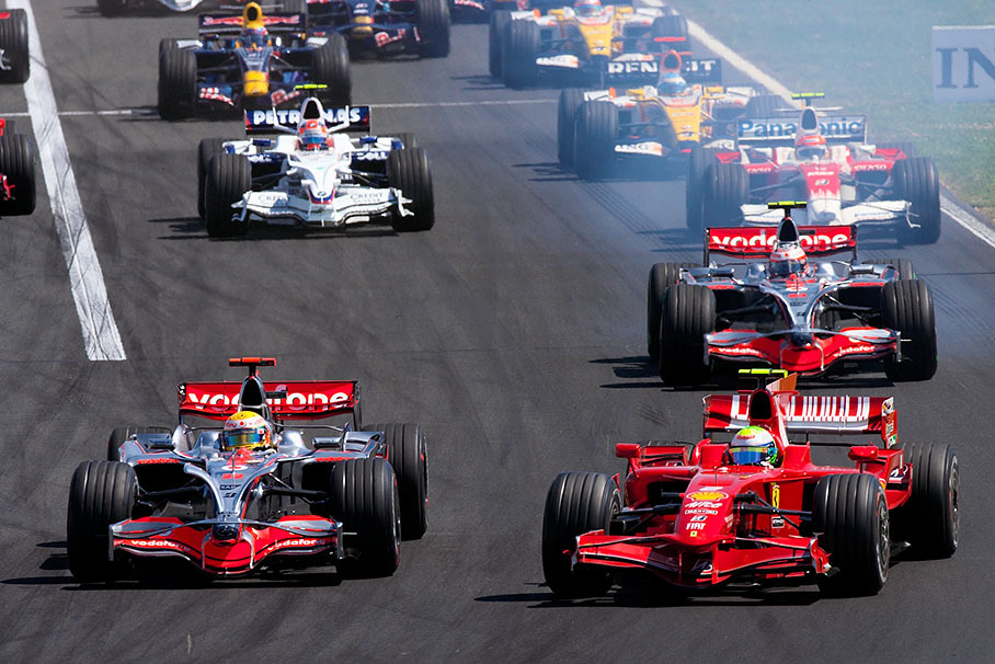 Massa performs a fabulous speedy sprint start and overtakes Kovalainen's McLaren with smoking tires at first corner just before overtaking leading Hamilton