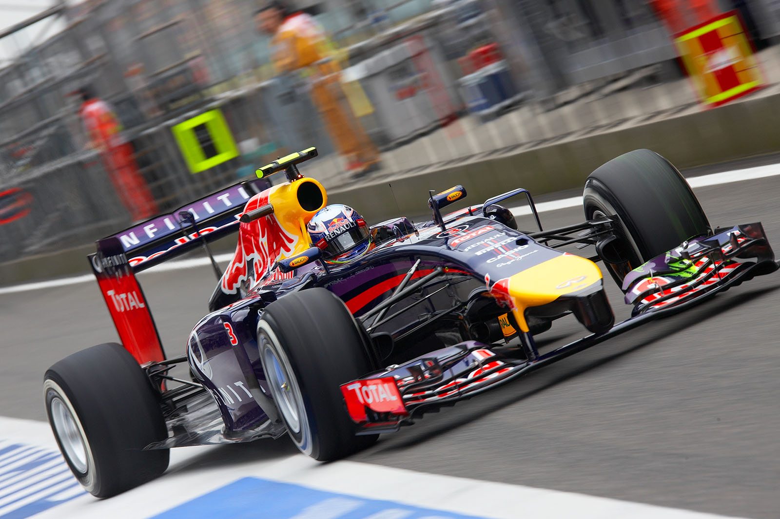 Daniel Ricciardo, Red Bull, driving out of the pits on Friday morning dry free practice session