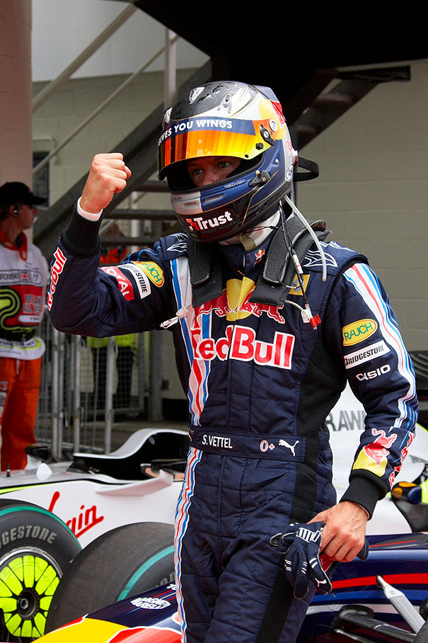 Sebastian Vettel enjoys his pole position in parc ferme