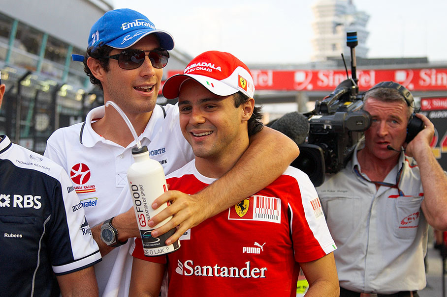Bruno Senna hugs Felipe Massa on their way to drivers parade