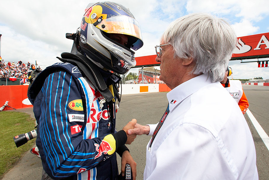 Before the race, Bernie Ecclestone wishes polesitter Sebastian Vettel the best of luck besides the grid