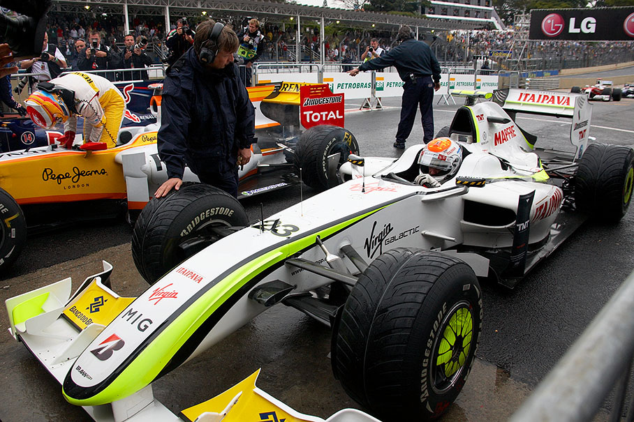 Polesetter Barrichello arrives at parc ferme after Q3