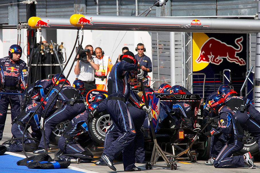 Sebastian Vettel performes his mandatory stop at Red Bull Racing pits one lap before the end of the race for the change from option to prime tyres