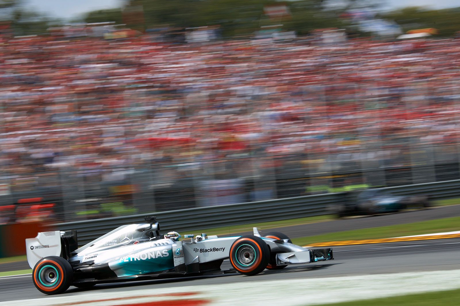 As Rosberg has locked up a front wheel in Turn 1 he gets straight and will lose the lead to team-mate Lewis Hamilton, Italian Grand Prix, Monza, 2014