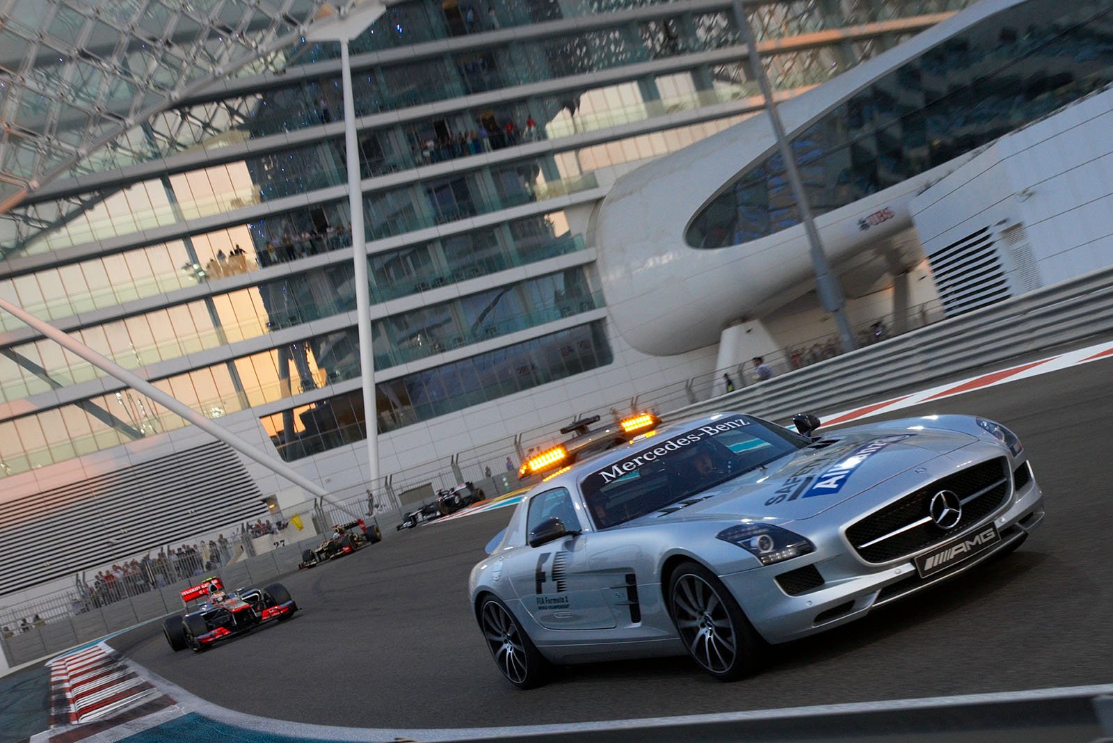 Bernd Maylaender in the safety car leads the field whilst the track is cleaned after an accident